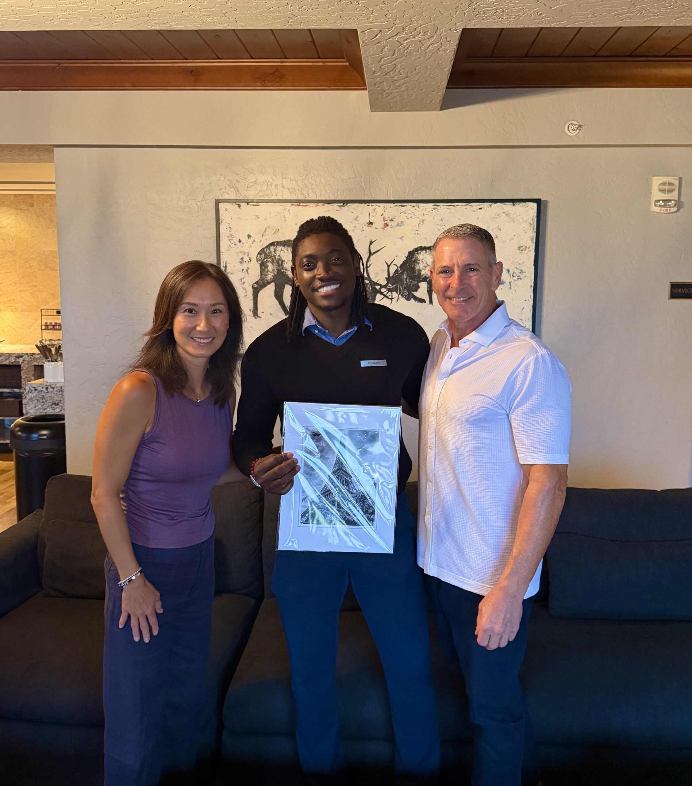 Andrew with Paul and Tina, holding their Eiffel Tower souvenir print